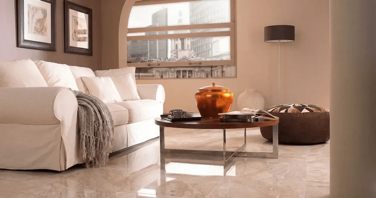 Modern living room with professionally installed marble flooring, a beige sofa, coffee table in Albuquerque, NM