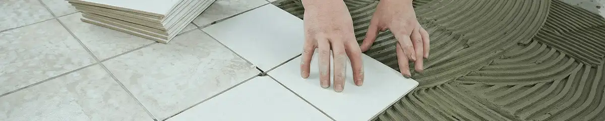 Professional installing white tile floors in Albuquerque, NM