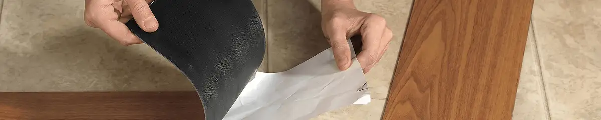 A professional installing vinyl flooring in Albuquerque, NM